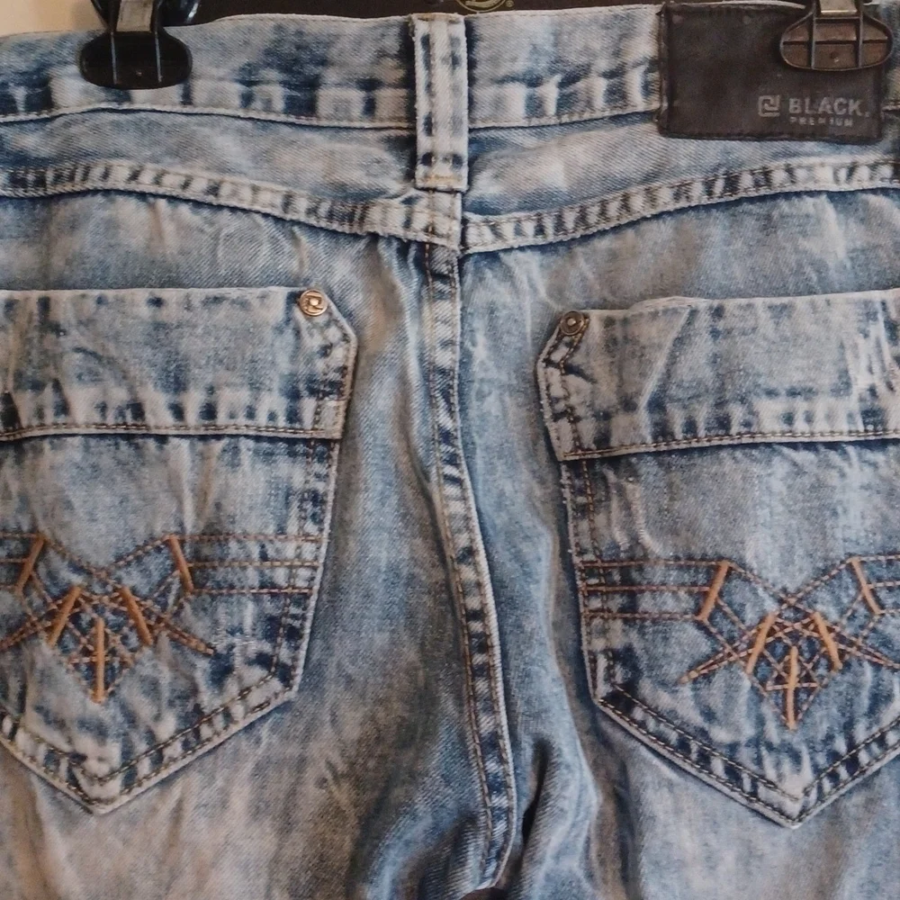 Black brand super distressed, acid wash looking jeans.Size 30x32.
